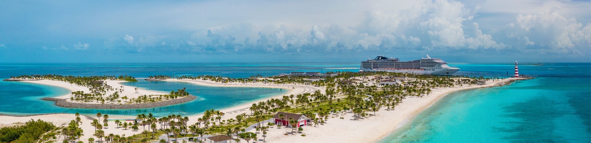 A panoramic view of Ocean Cay with turquoise waters, white sandy beaches, and an MSC cruise ship docked | MSC Cruises A panoramic view of Ocean Cay with turquoise waters, white sandy beaches, and an MSC cruise ship docked | MSC Cruises