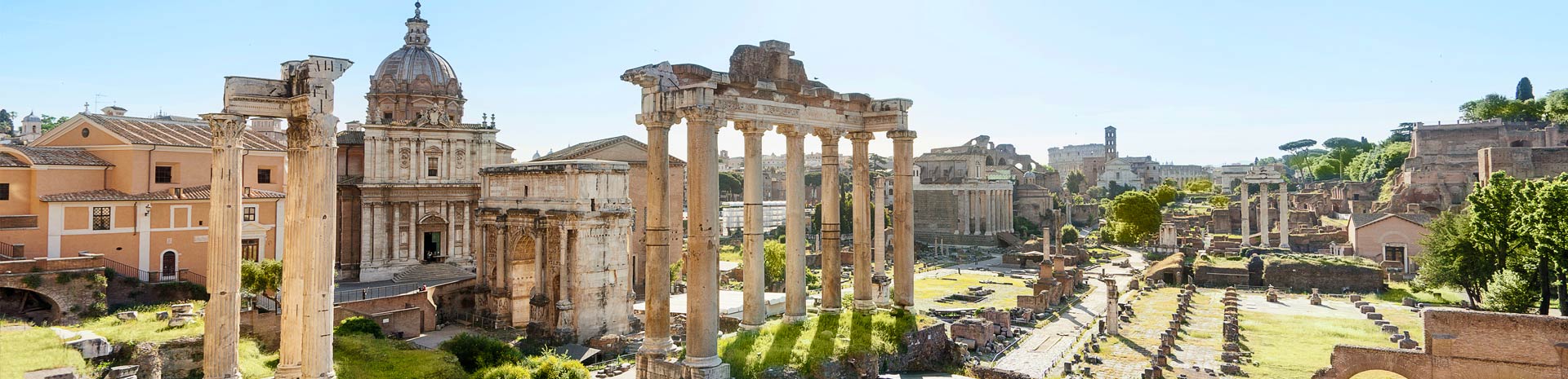 Ancient Roman ruins of the Forum in Rome under a bright blue sky | MSC Cruises Ancient Roman ruins of the Forum in Rome under a bright blue sky | MSC Cruises