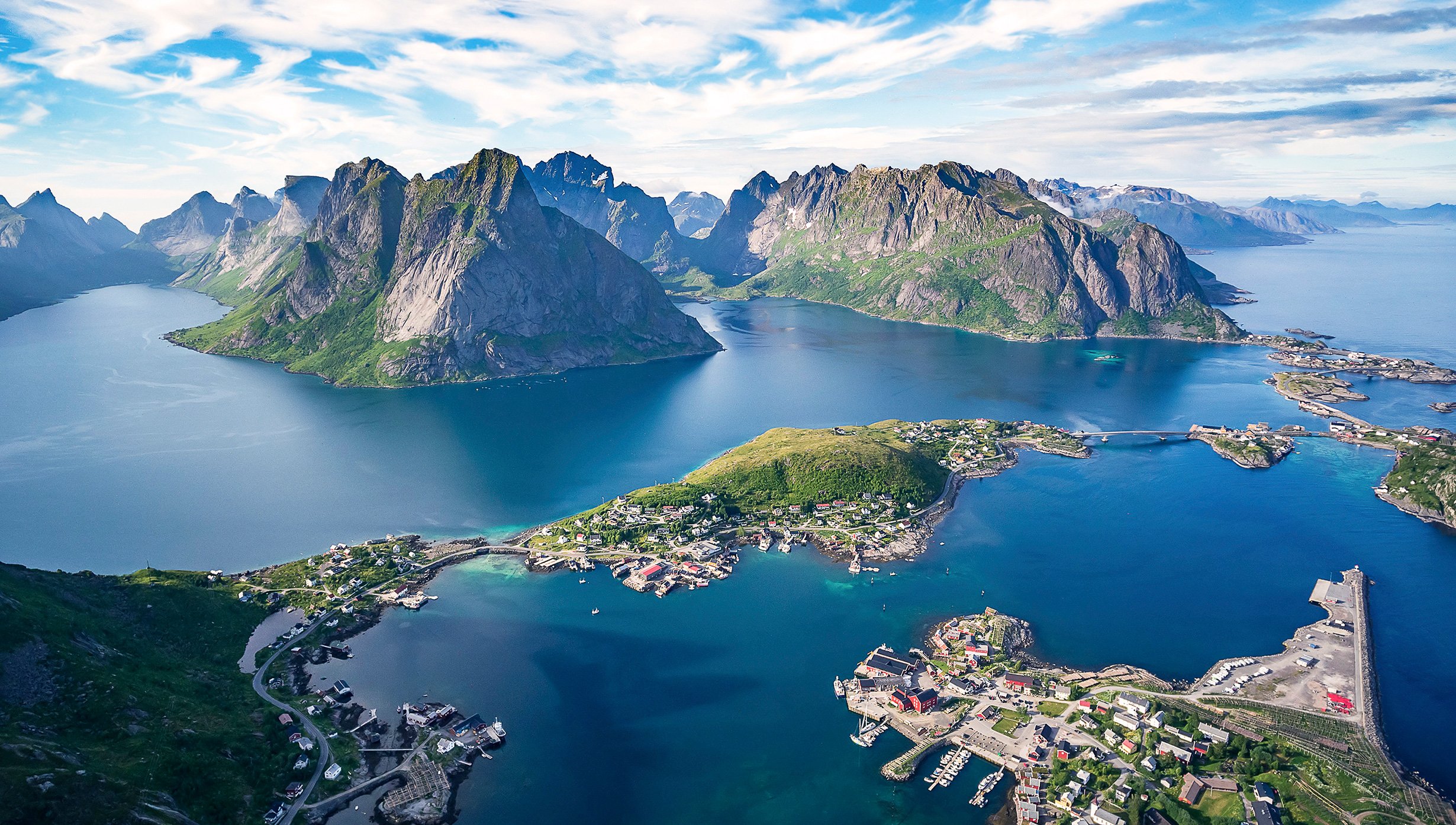 Aerial view of Norway's Lofoten Islands with dramatic peaks and coastal villages | MSC Cruises Aerial view of Norway's Lofoten Islands with dramatic peaks and coastal villages | MSC Cruises