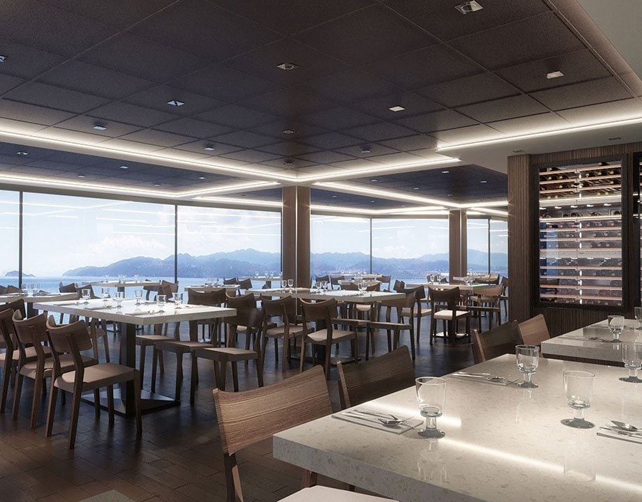 Elegant onboard restaurant with panoramic sea views and a wine display cabinet | MSC Cruises Elegant onboard restaurant with panoramic sea views and a wine display cabinet | MSC Cruises