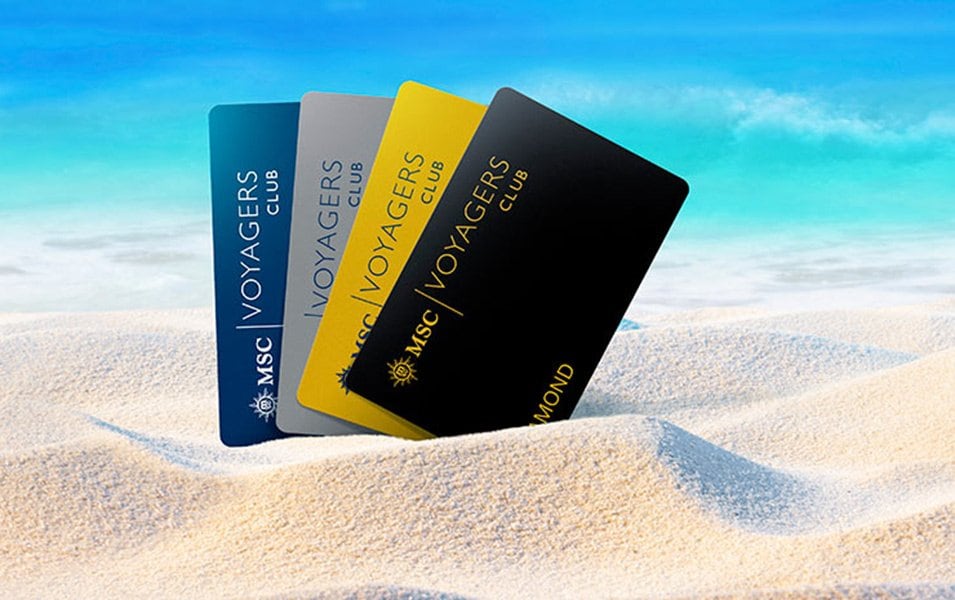 MSC Voyagers Club membership cards on sandy beach with turquoise sea background | MSC Cruises MSC Voyagers Club membership cards on sandy beach with turquoise sea background | MSC Cruises